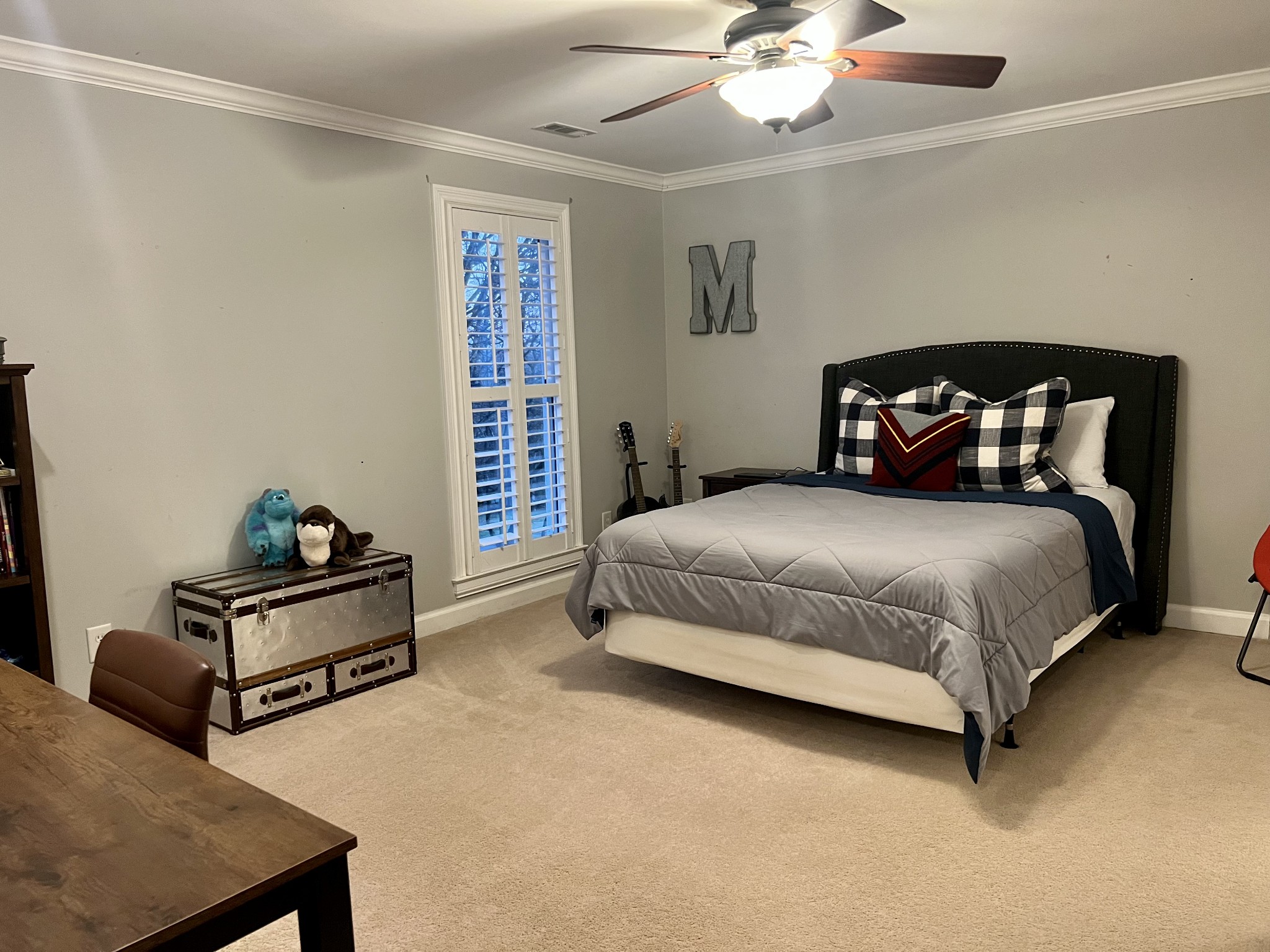 4264 Warren Road Franklin, TN 37067 - Photo 23 of 49 a bedroom with a bed and a chandelier