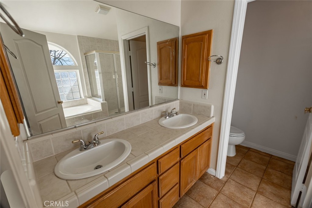 12384 Redwood Road Pinon Hills, CA 92372 - Photo 16 of 35 a bathroom with a sink and a mirror