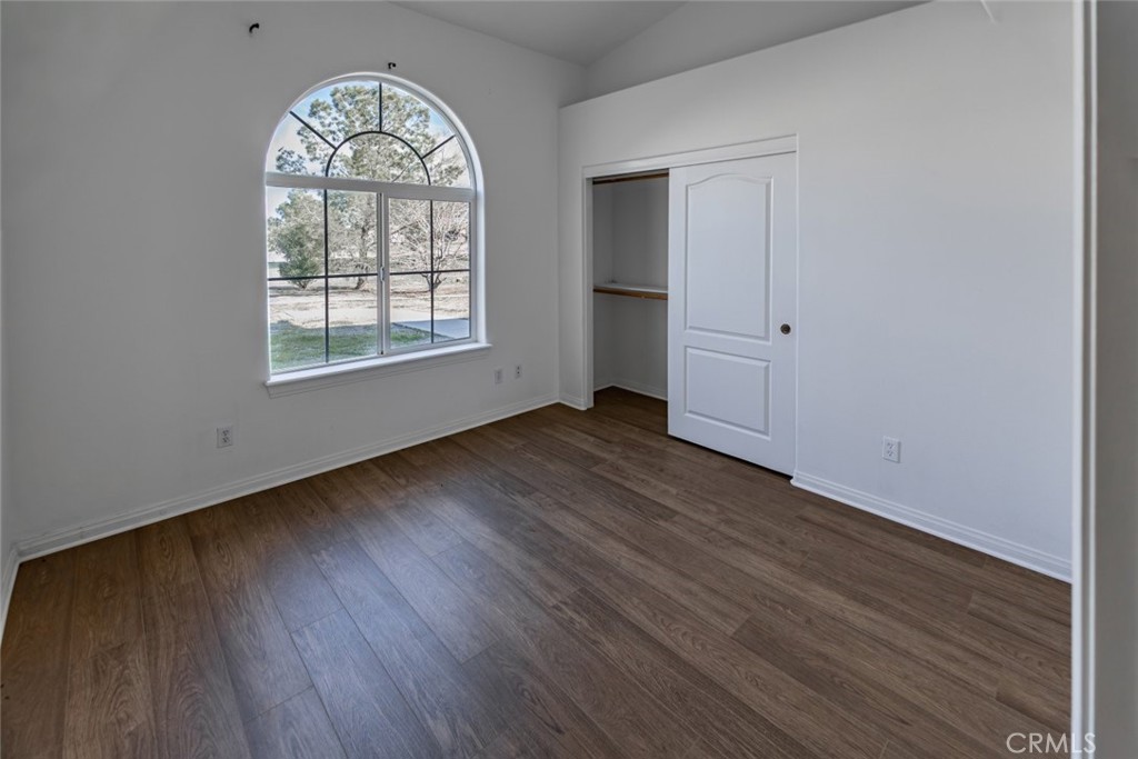 12384 Redwood Road Pinon Hills, CA 92372 - Photo 20 of 35 wooden floor in an empty room with a window