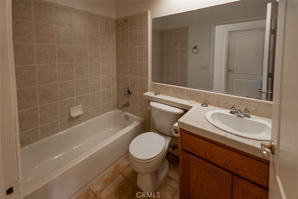 12384 Redwood Road Pinon Hills, CA 92372 - Photo 22 of 35 a bathroom with a sink a toilet and shower