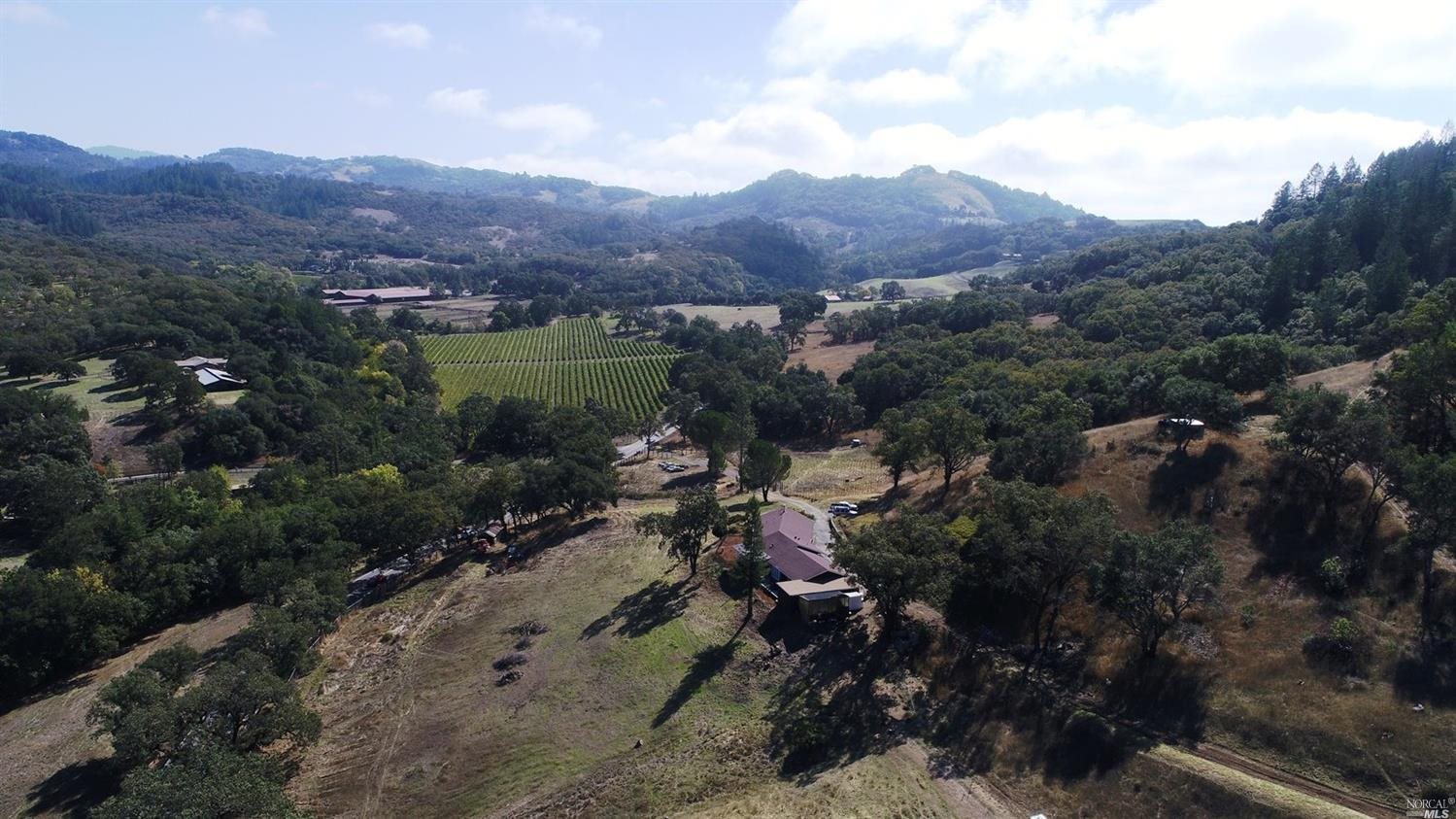 an aerial view of residential house with outdoor space