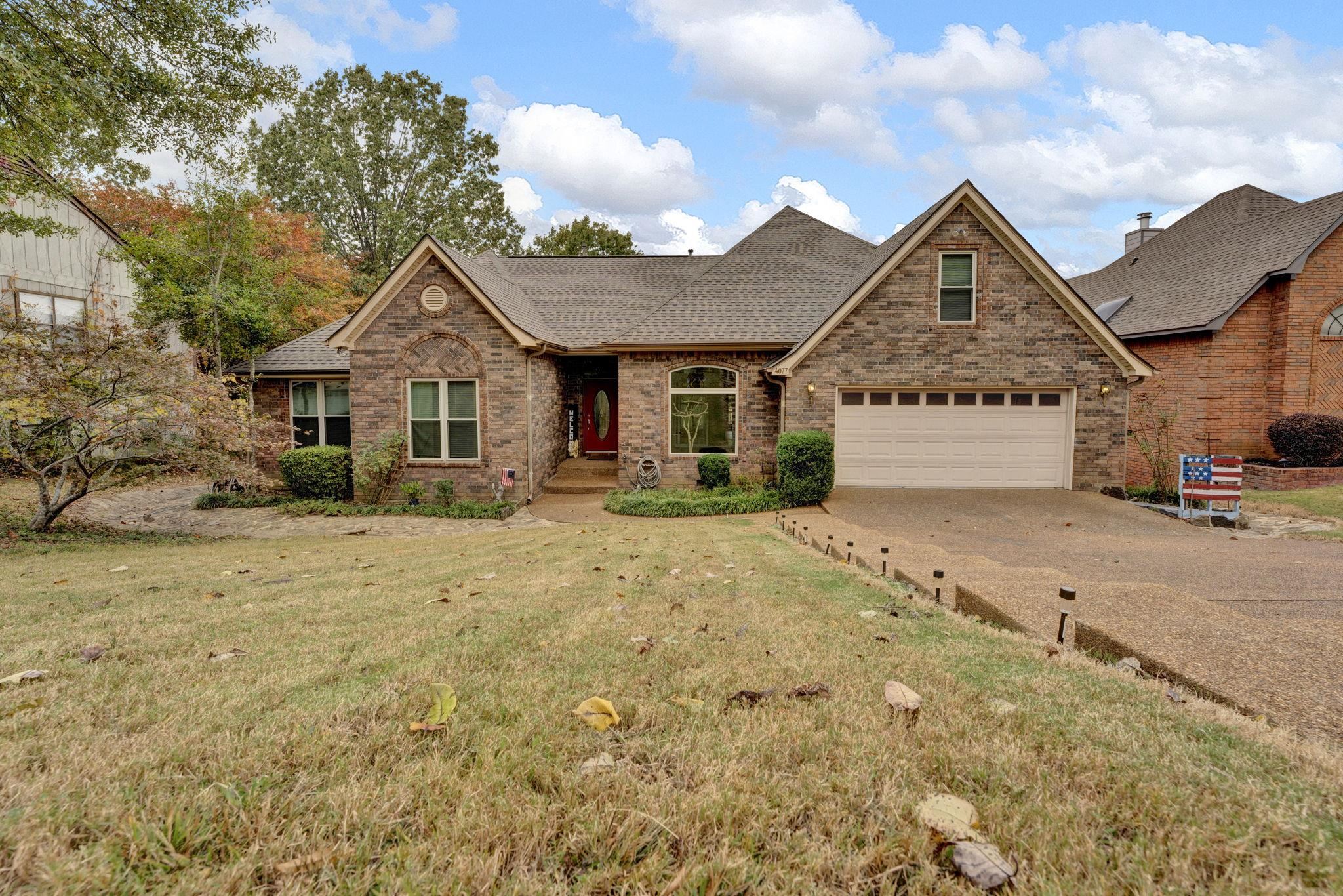 4077 Cedar Point Road Lakeland, TN 38002 - Photo 1 of 25 a front view of a house with a yard
