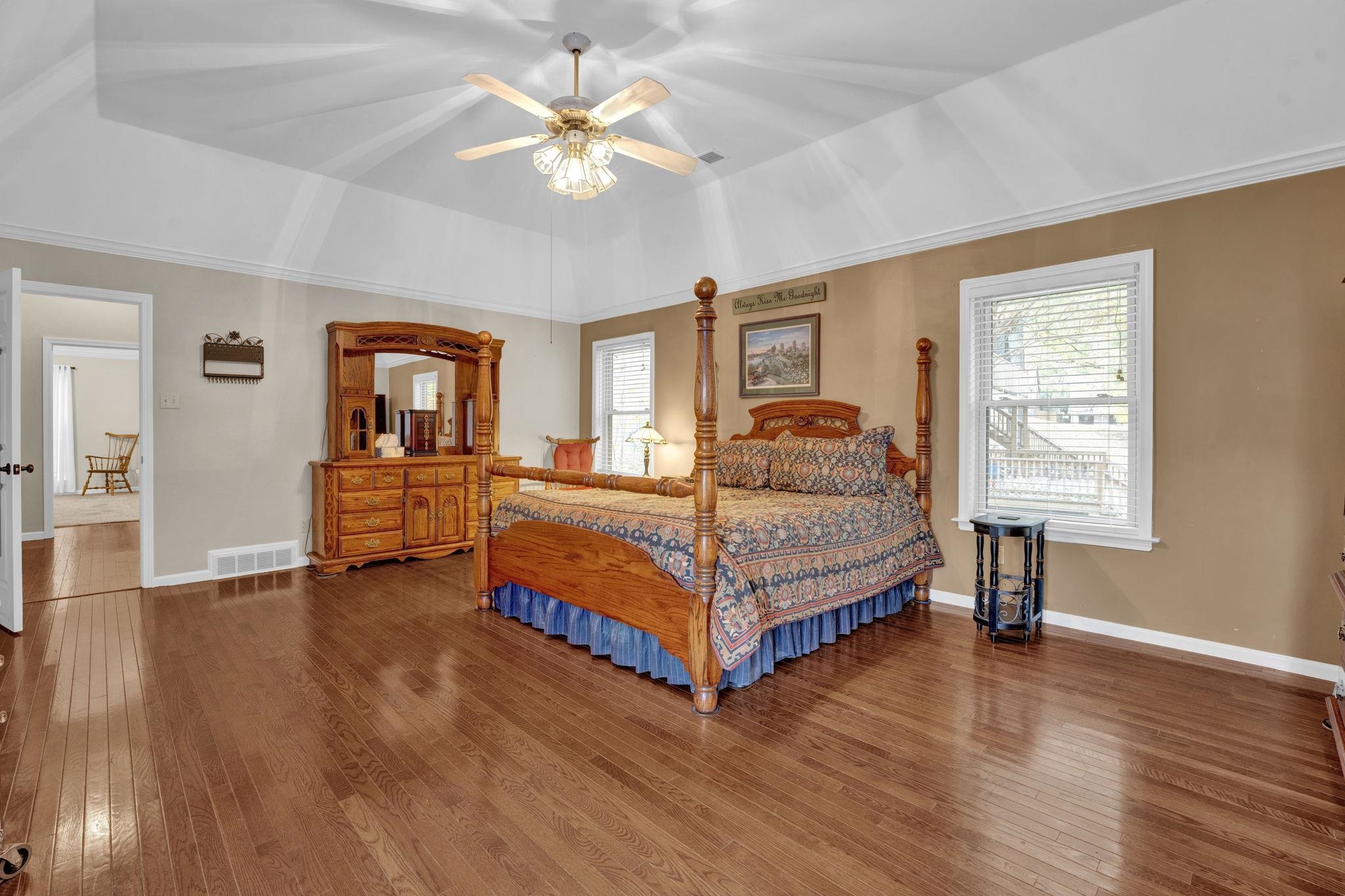 4077 Cedar Point Road Lakeland, TN 38002 - Photo 11 of 25 a bedroom with a bed and a table in it with window