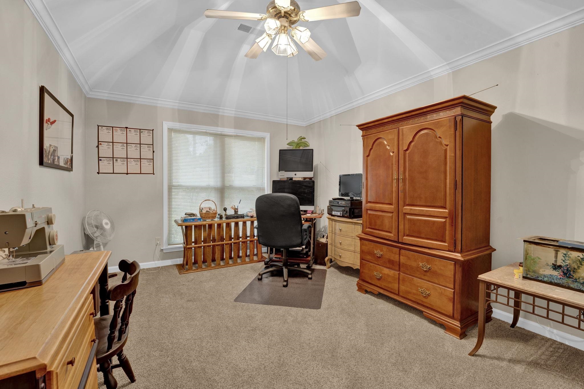 4077 Cedar Point Road Lakeland, TN 38002 - Photo 16 of 25 a view of a workspace with furniture and a window
