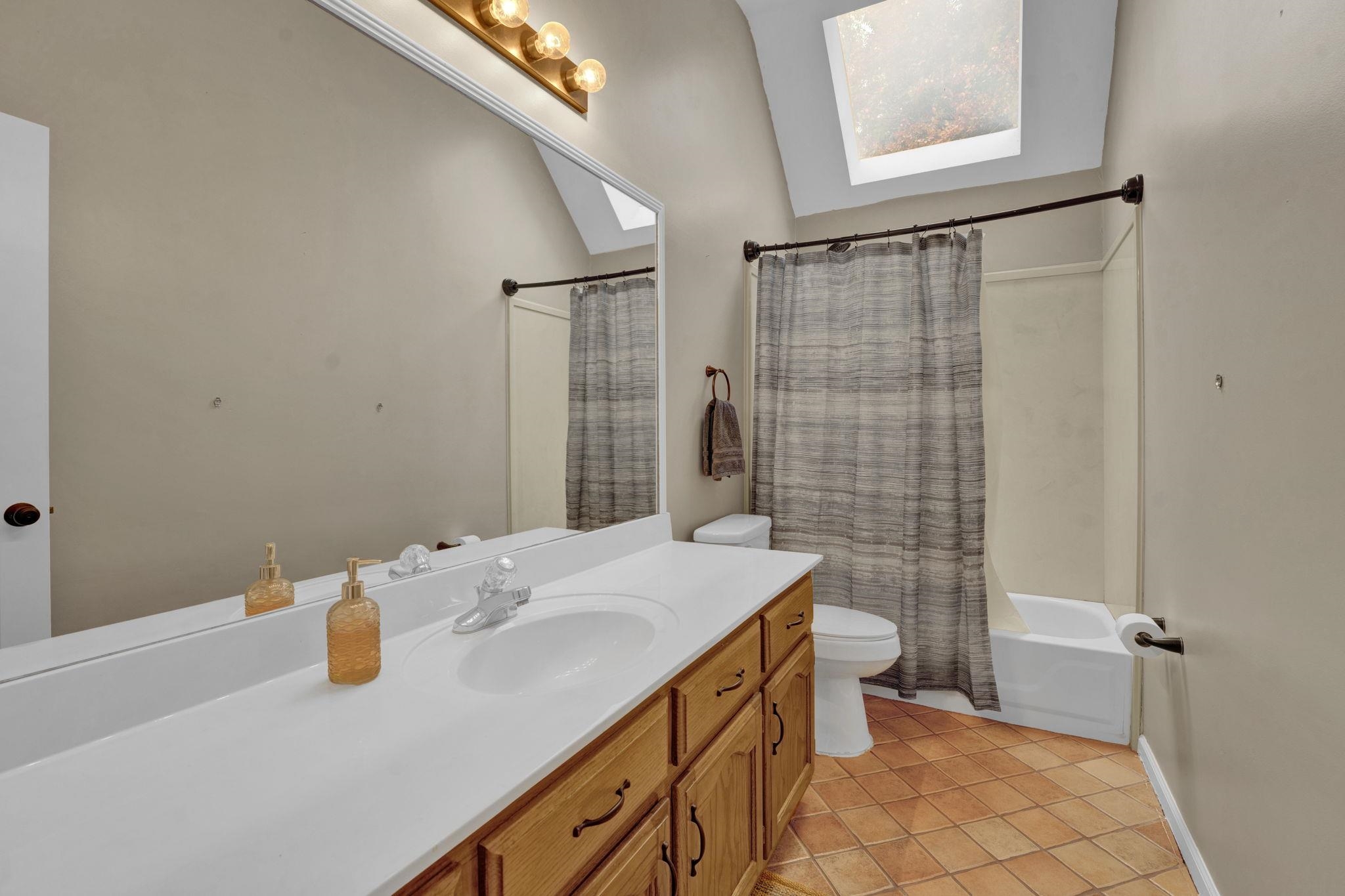 4077 Cedar Point Road Lakeland, TN 38002 - Photo 17 of 25 a bathroom with a sink toilet and shower