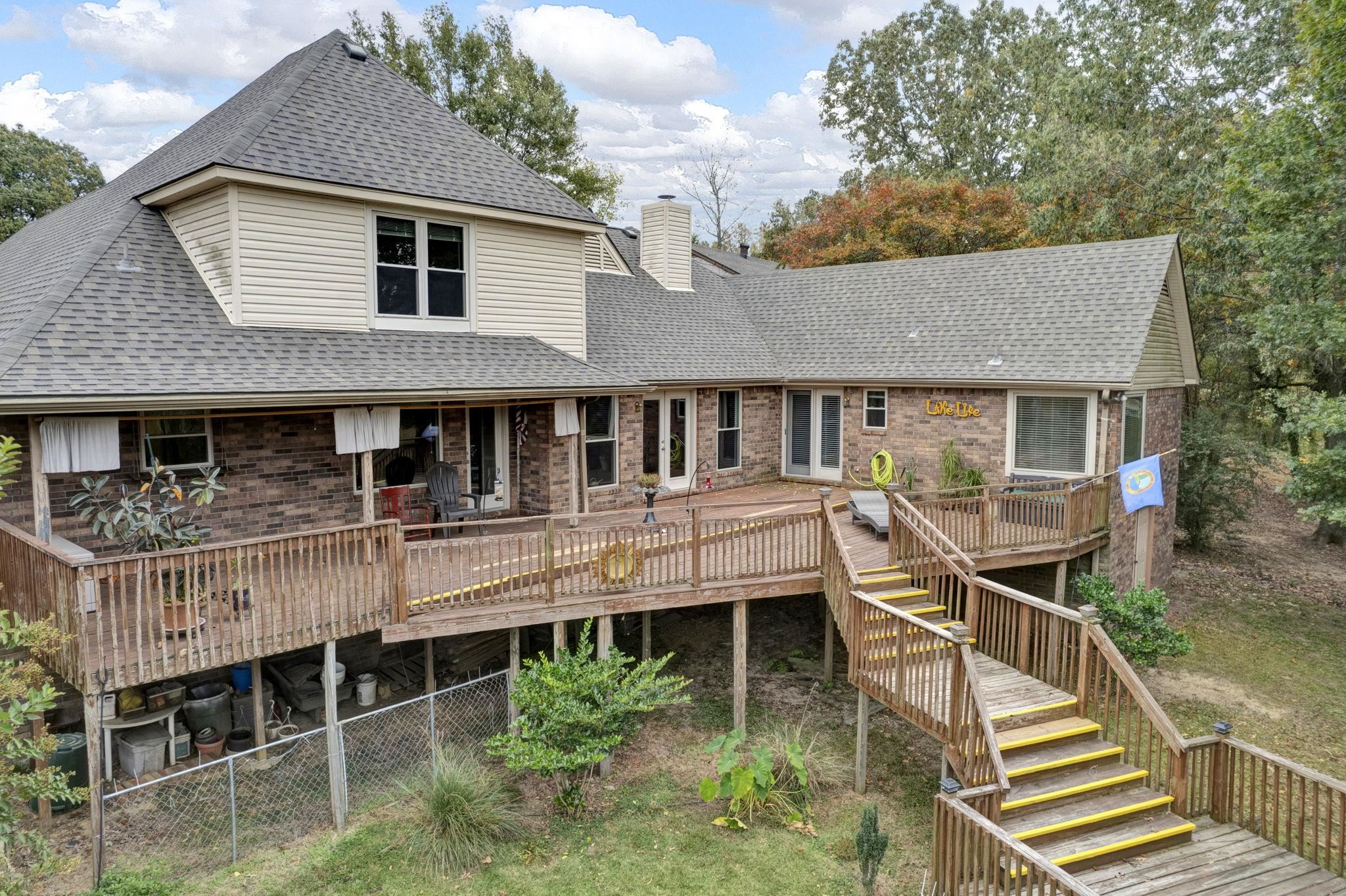 4077 Cedar Point Road Lakeland, TN 38002 - Photo 20 of 25 a aerial view of a house with a deck and a yard
