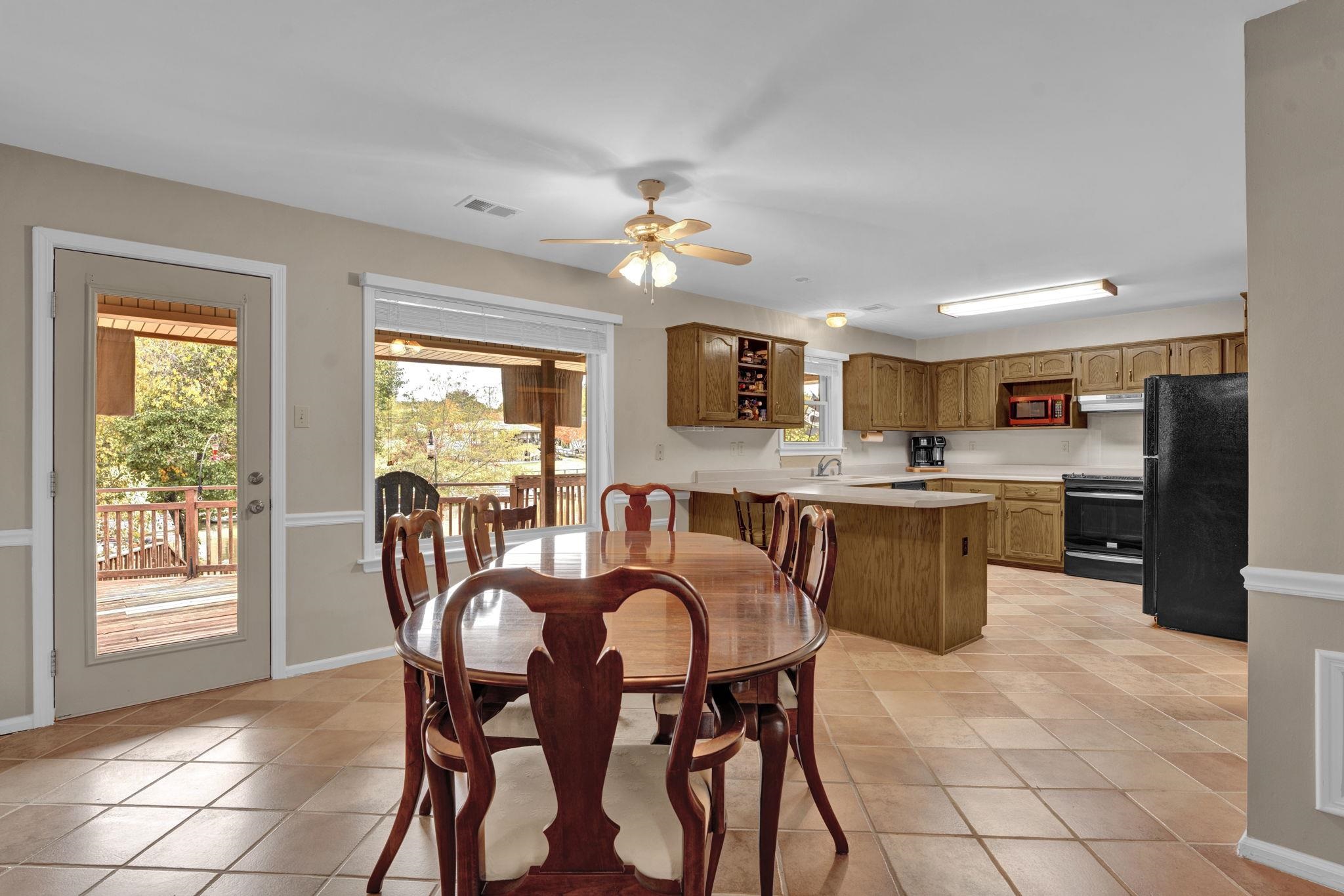 4077 Cedar Point Road Lakeland, TN 38002 - Photo 4 of 25 a view of a dining room with furniture and a chandelier
