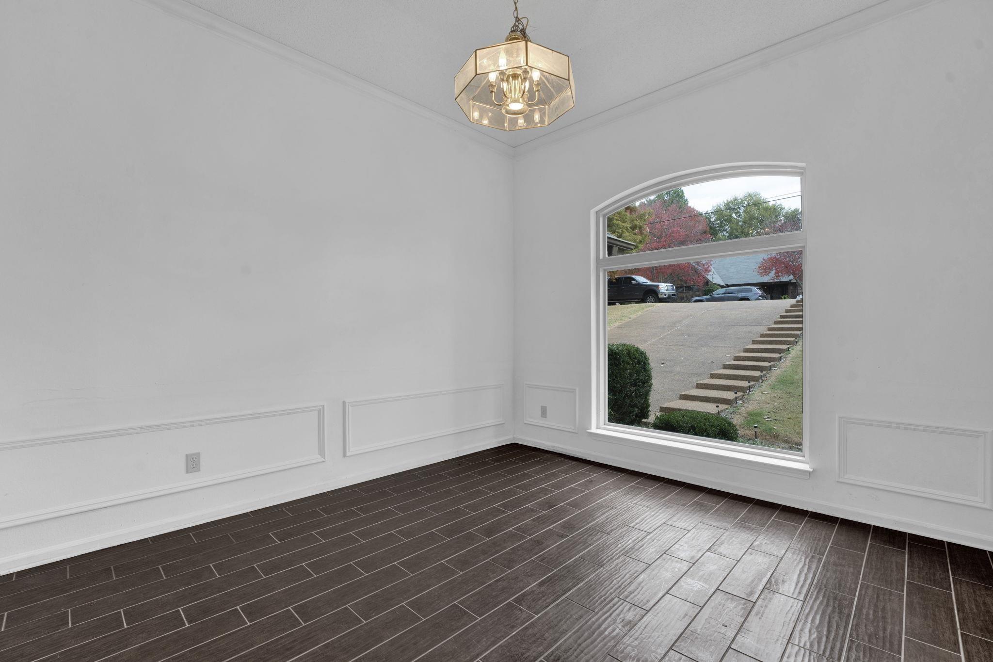 4077 Cedar Point Road Lakeland, TN 38002 - Photo 9 of 25 wooden floor in an empty room with a window