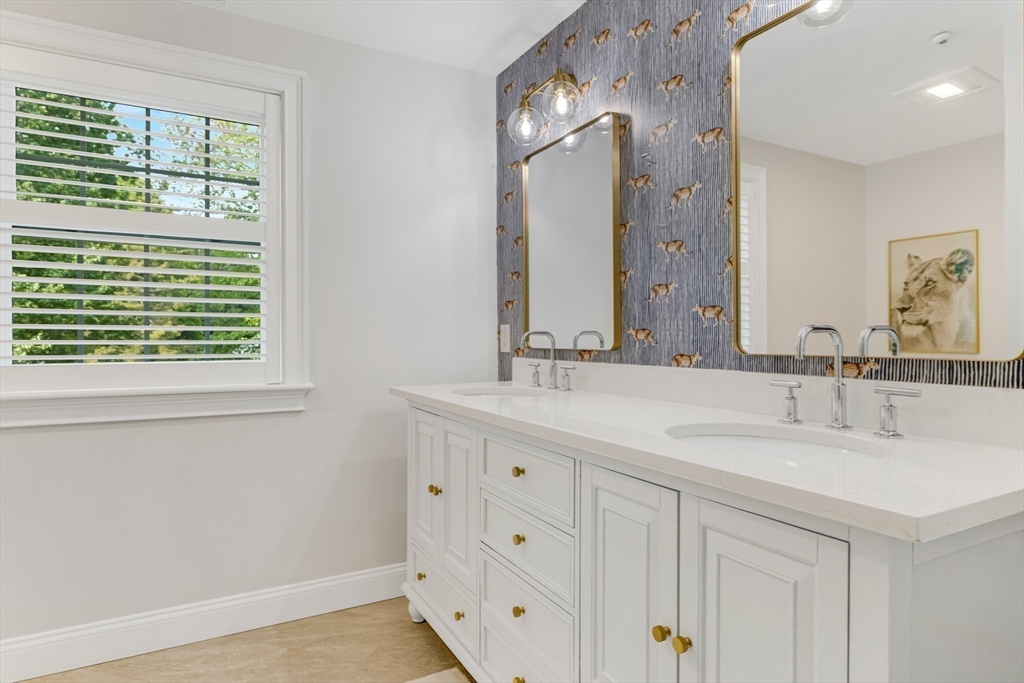 85 Old Farm Road Milton, MA 02186 - Photo 22 of 42 a bathroom with double vanity sink a mirror and a window