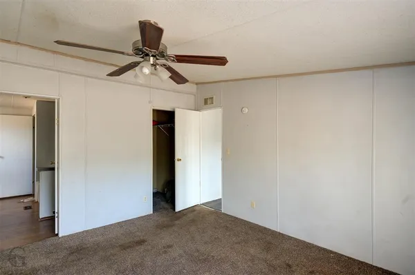 a view of a chandelier fan in a room