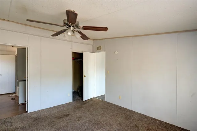 a view of a chandelier fan in a room