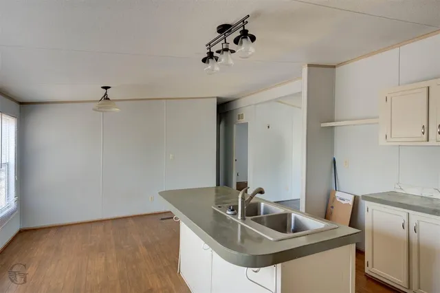 a bathroom with a sink and vanity