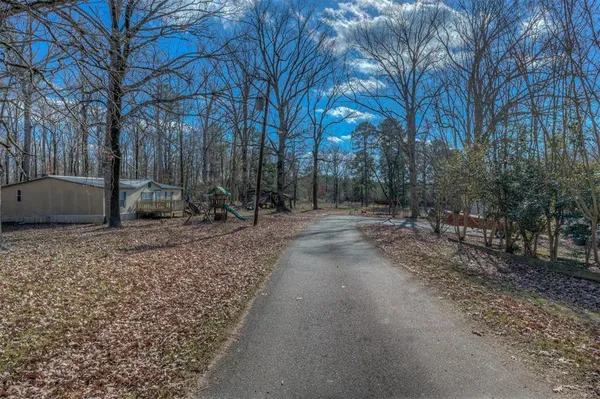 a backyard of a house with lots of green space