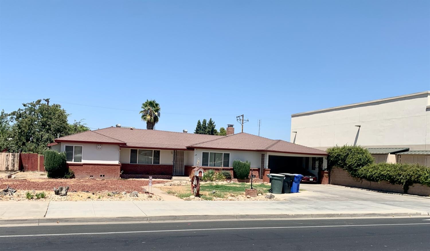 56 West Hanford Armona Road Lemoore, CA 93245 - Photo 14 of 15 a view of house with yard and sitting area
