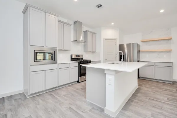a view of kitchen with wooden floor