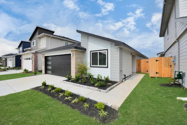 a front view of a house with a yard and porch