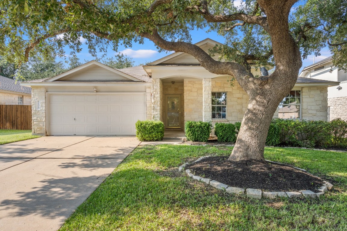 1609 Abbey Lane Cedar Park, TX 78613 - Photo 1 of 1 a front view of a house with garden