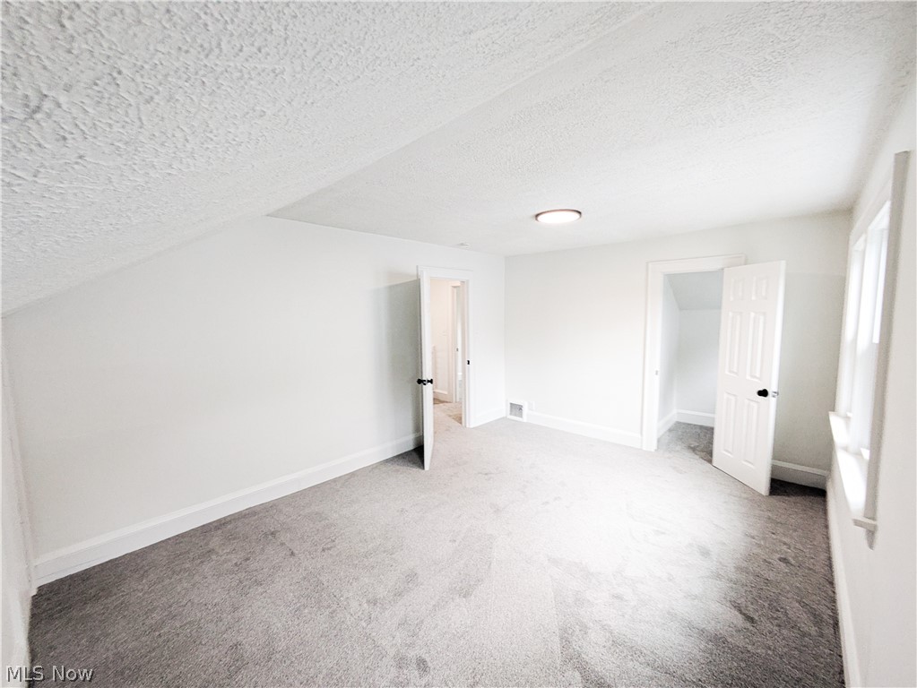 3554 Ludgate Road Shaker Heights, OH 44120 - Photo 32 of 50 Bedroom on 2nd level featuring white painted walls, gray carpet flooring, a flush-mount ceiling light, and white paneled doors with black hardware