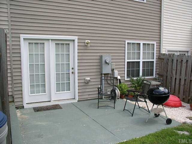 506 Erie Road Raleigh, NC 27610 - Photo 7 of 7 a view of a house with chairs and table in a patio