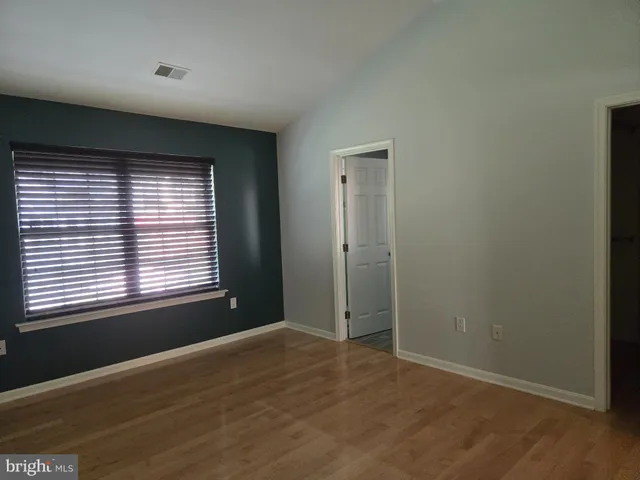 a bathroom with double sink and a mirror