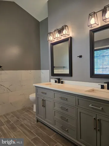 a bathroom with a bathtub and a window