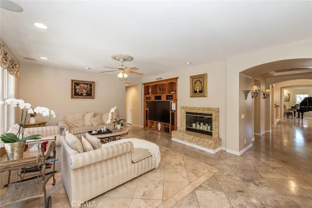 a bathroom with a granite countertop toilet sink and mirror