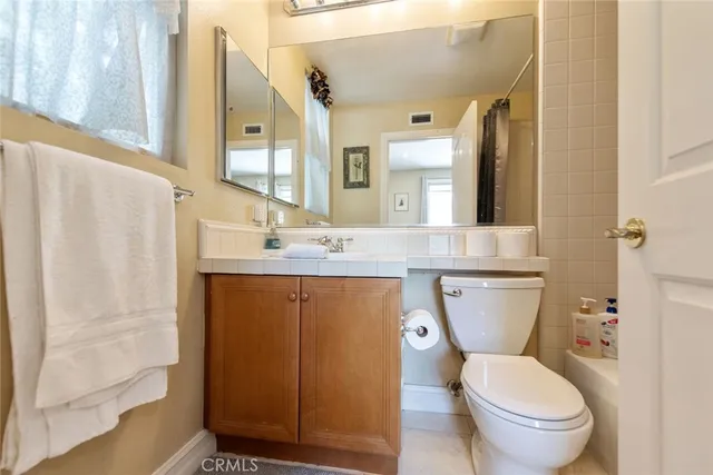 a large white tub sitting in a bathroom