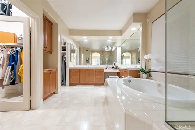 a spacious bedroom with a bed and a table