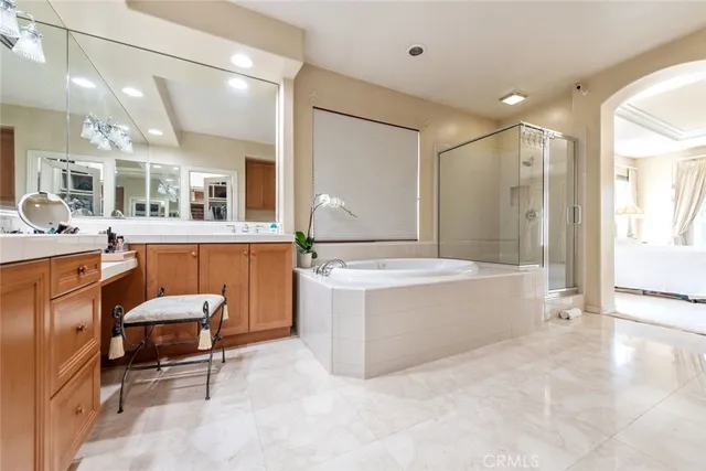 a view of a patio with couches table and chairs and potted plants