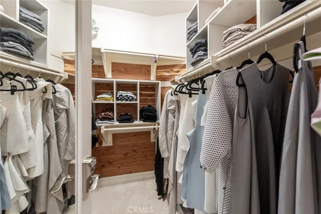 a view of a patio with table and chairs and potted plants