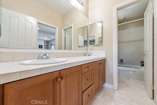 a view of a patio with table and chairs potted plants
