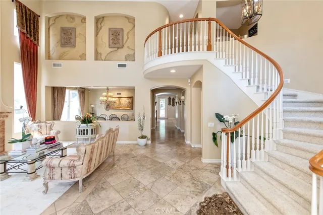 a spacious bedroom with a bed and a large window