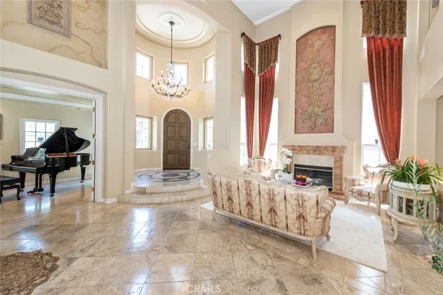 a living room with furniture fireplace and flat screen tv