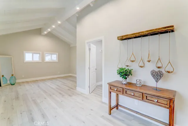 a view of an entryway with wooden floor