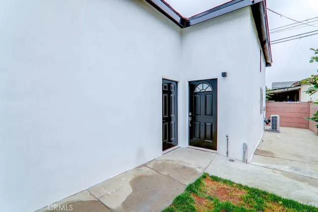a view of a house with a small yard