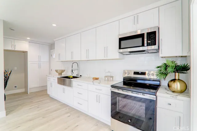 a bathroom with a sink toilet tub and shower