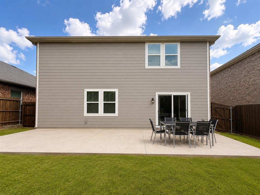 824 Juniper Street Anna, TX 75409 - Photo 23 of 25 Expansive concrete patio with direct access to interior via sliding glass door
