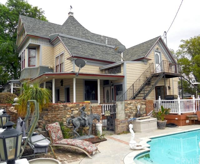 Commanding rear view of 5809 Brockton Ave (Riverside CA 92501) with 15-yr-old inground pool and spa, as well as 15-yr-old composition roof. Lots of upgrades in this amazing historic home!
