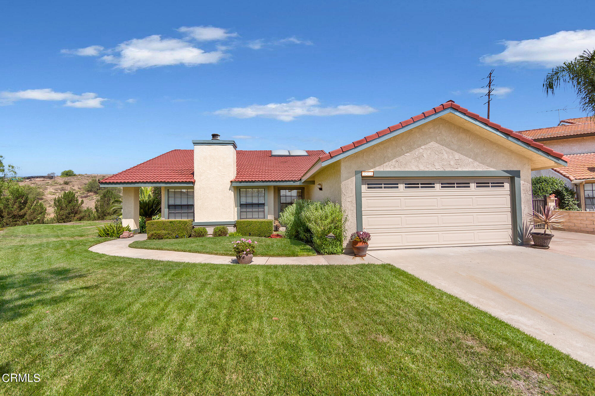 777 Sir George Court Moorpark, CA 93021 - Photo 1 of 22 a front view of a house with a yard and garage