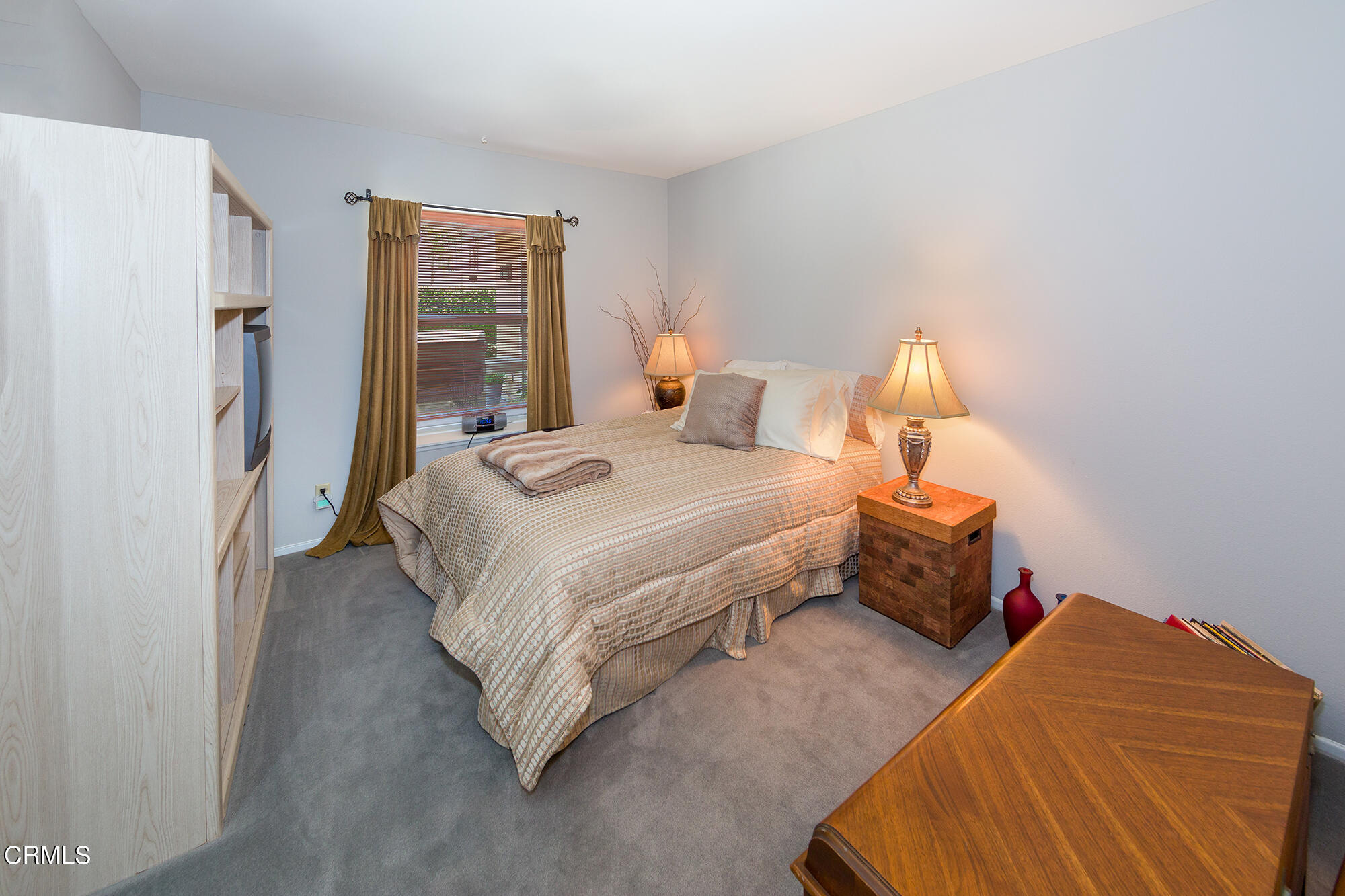 777 Sir George Court Moorpark, CA 93021 - Photo 12 of 22 a bedroom with a bed and a lamp