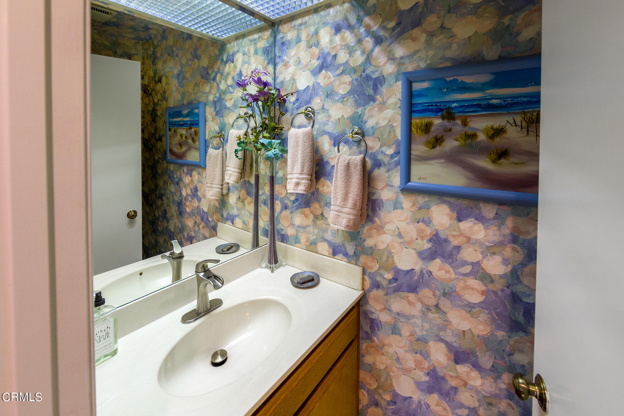 777 Sir George Court Moorpark, CA 93021 - Photo 16 of 22 a bathroom with a sink and a mirror