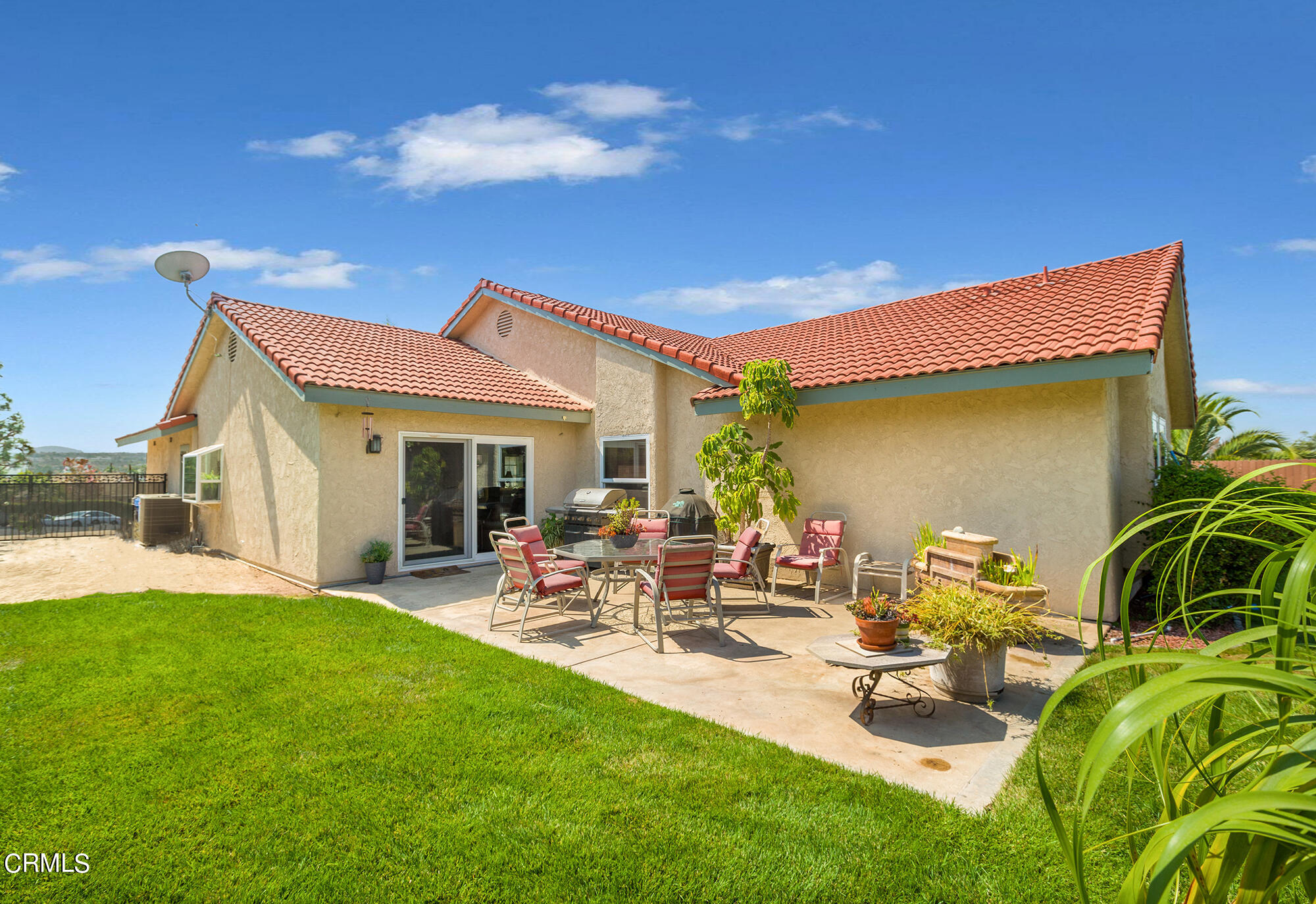 777 Sir George Court Moorpark, CA 93021 - Photo 18 of 22 a view of backyard of house with outdoor seating and green space
