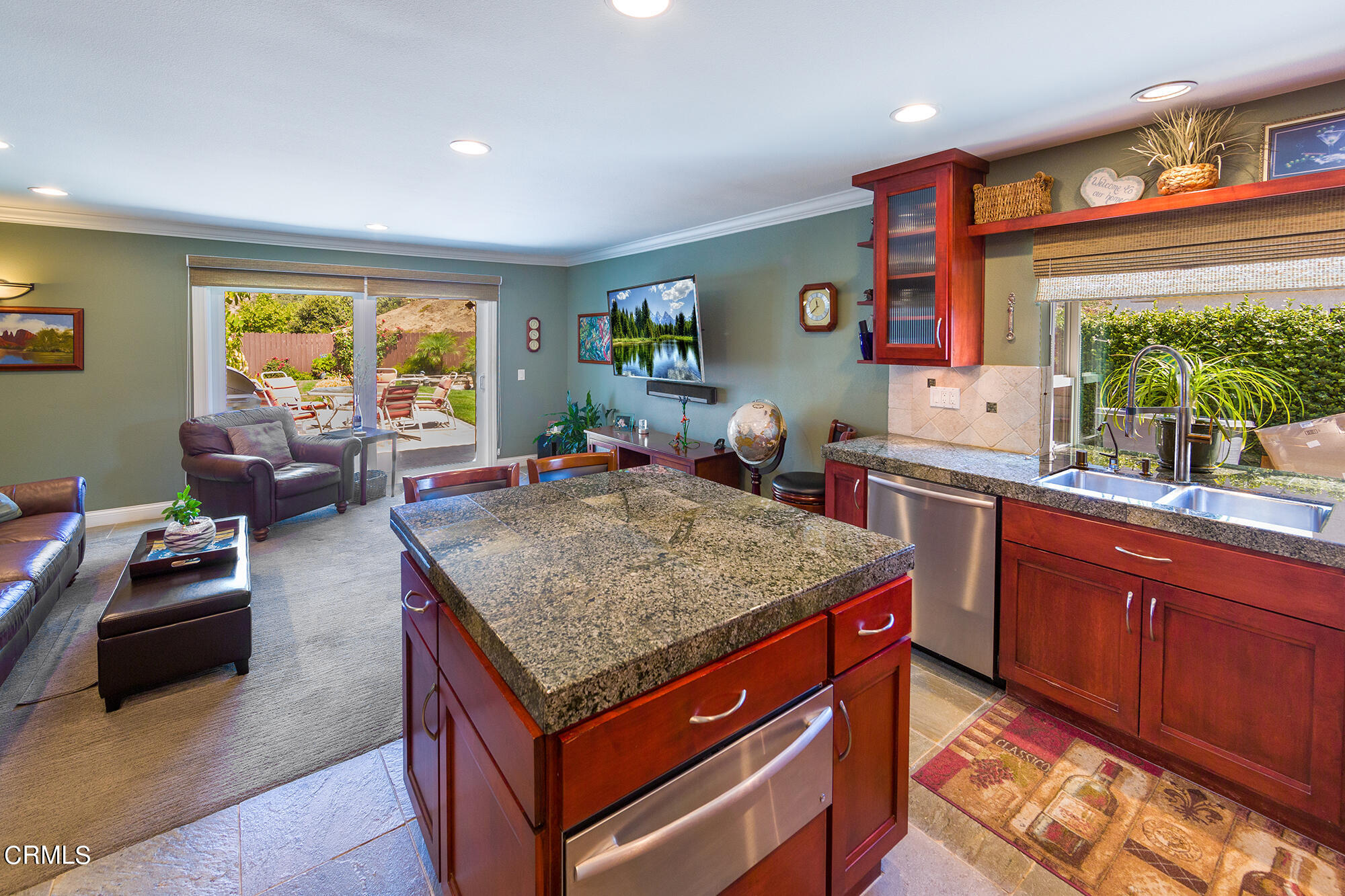 777 Sir George Court Moorpark, CA 93021 - Photo 5 of 22 a kitchen with stainless steel appliances granite countertop sink stove and wooden cabinets