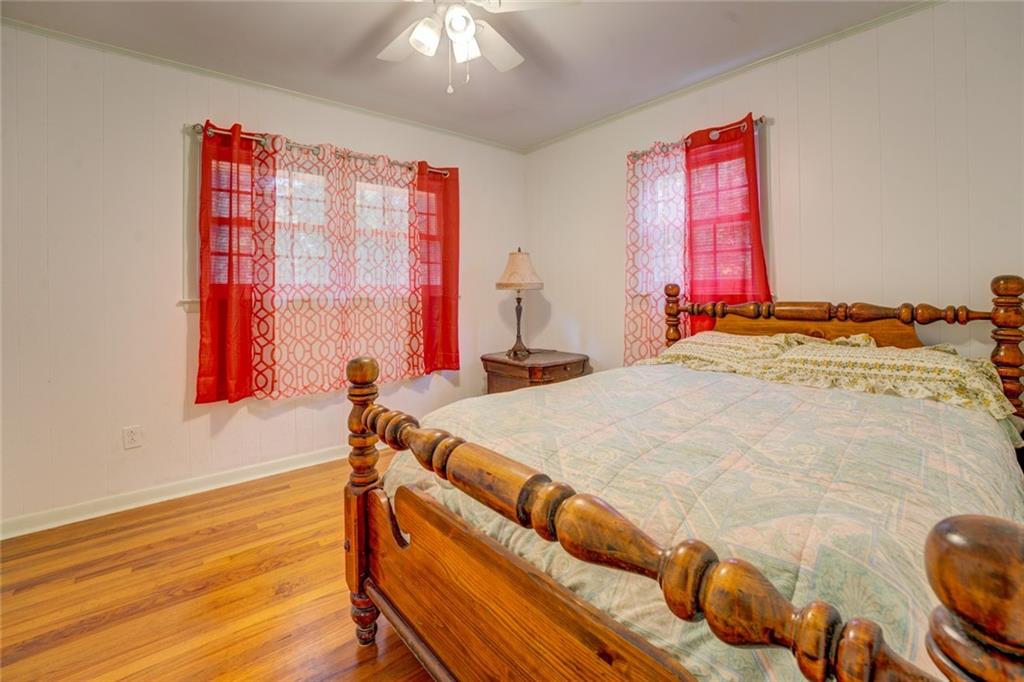 2194 Klondike Road Southwest Conyers, GA 30094 - Photo 16 of 30 a bed sitting in a bedroom next to a window