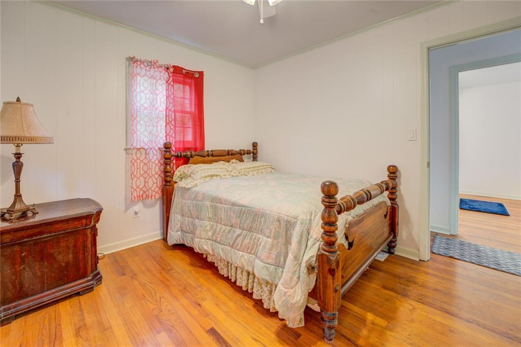 2194 Klondike Road Southwest Conyers, GA 30094 - Photo 17 of 30 a bedroom with a bed and a dresser