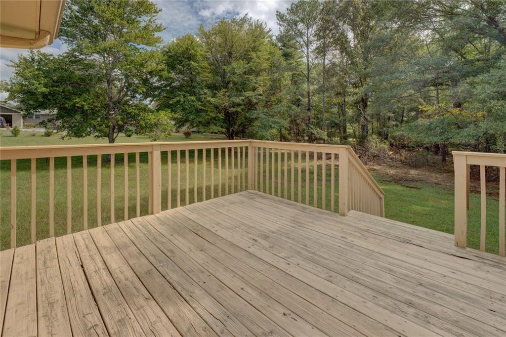 2194 Klondike Road Southwest Conyers, GA 30094 - Photo 23 of 30 a balcony with wooden floor and fence