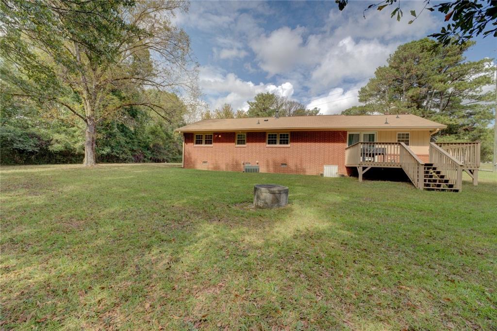 2194 Klondike Road Southwest Conyers, GA 30094 - Photo 28 of 30 a view of a house with a yard