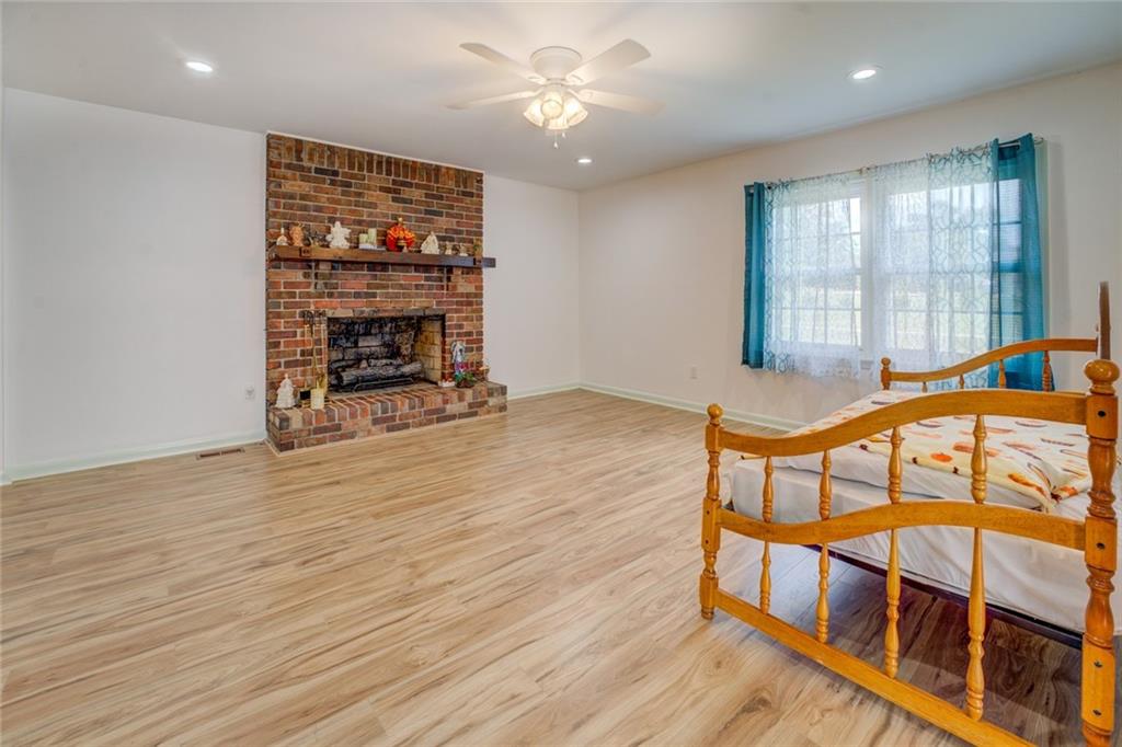 2194 Klondike Road Southwest Conyers, GA 30094 - Photo 5 of 30 wooden floor with a window in an empty room