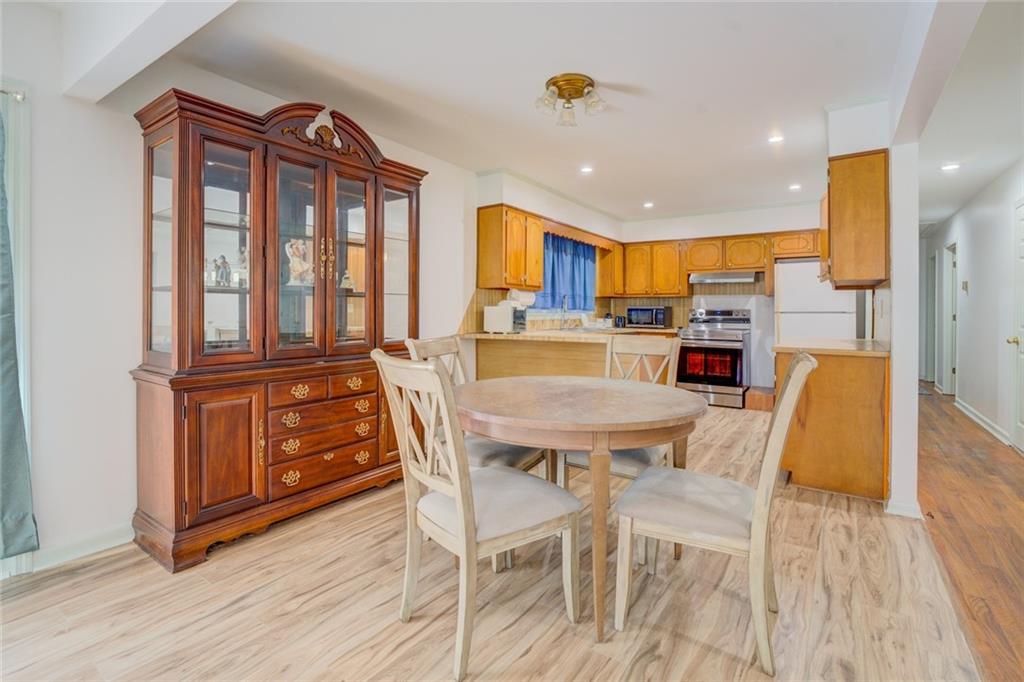2194 Klondike Road Southwest Conyers, GA 30094 - Photo 9 of 30 a view of a dining room with furniture window and wooden floor