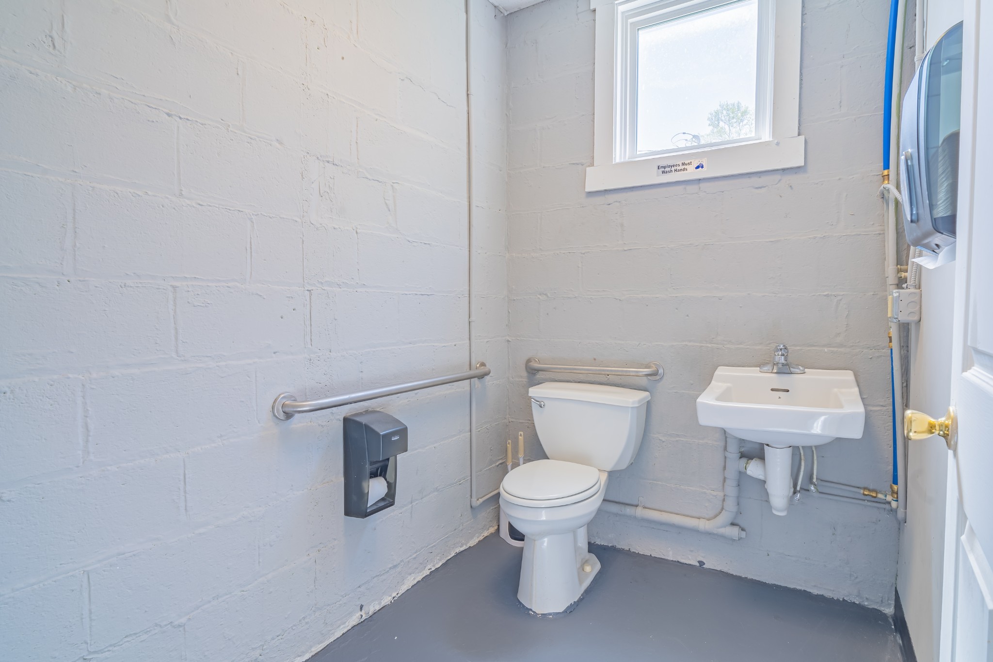 802 North Washington Street Tullahoma, TN 37388 - Photo 21 of 37 a white toilet sitting next to a bathroom sink